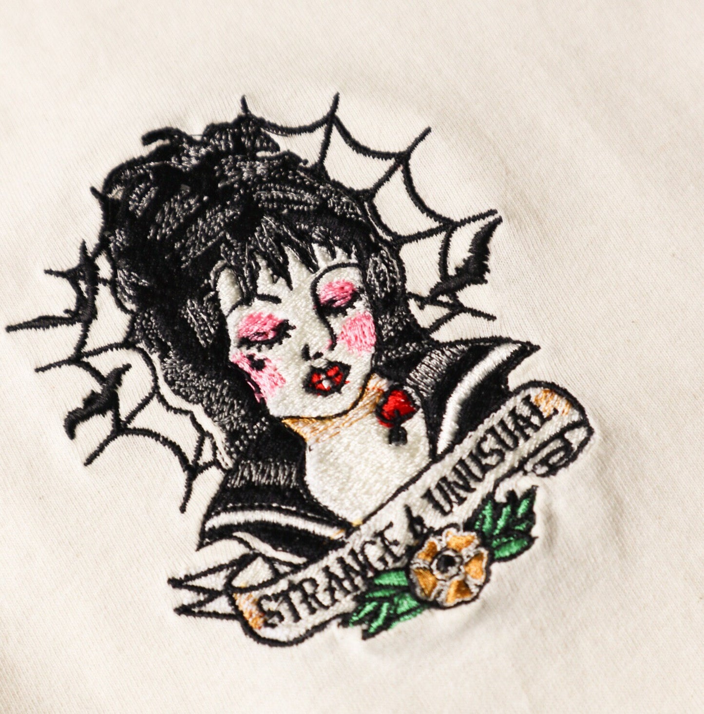 Strange And Unusual Embroidered T-Shirt