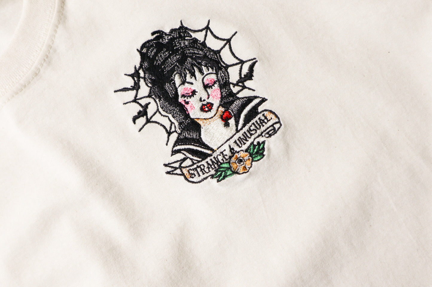 Strange And Unusual Embroidered T-Shirt