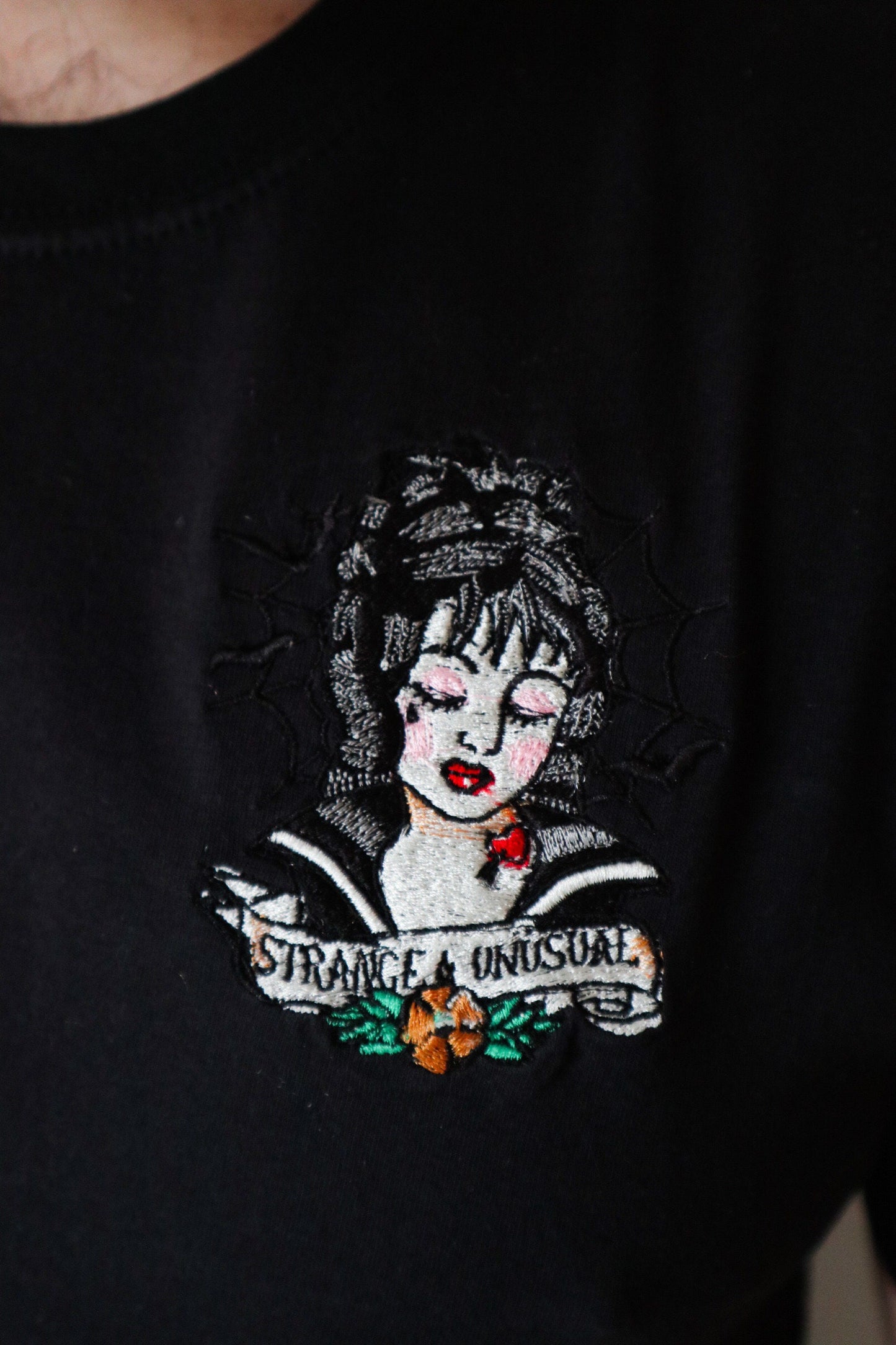 Strange And Unusual Embroidered T-Shirt