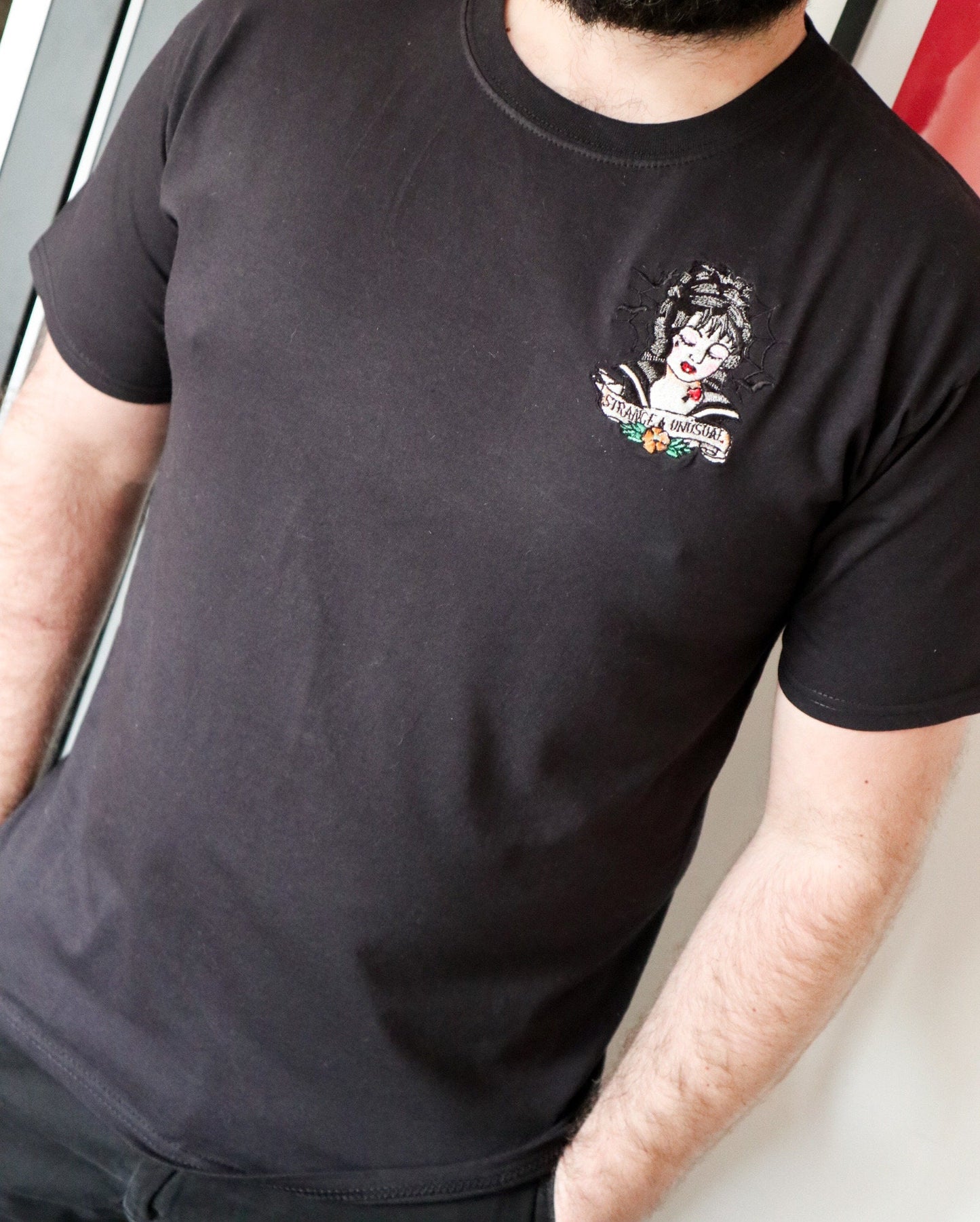 Strange And Unusual Embroidered T-Shirt